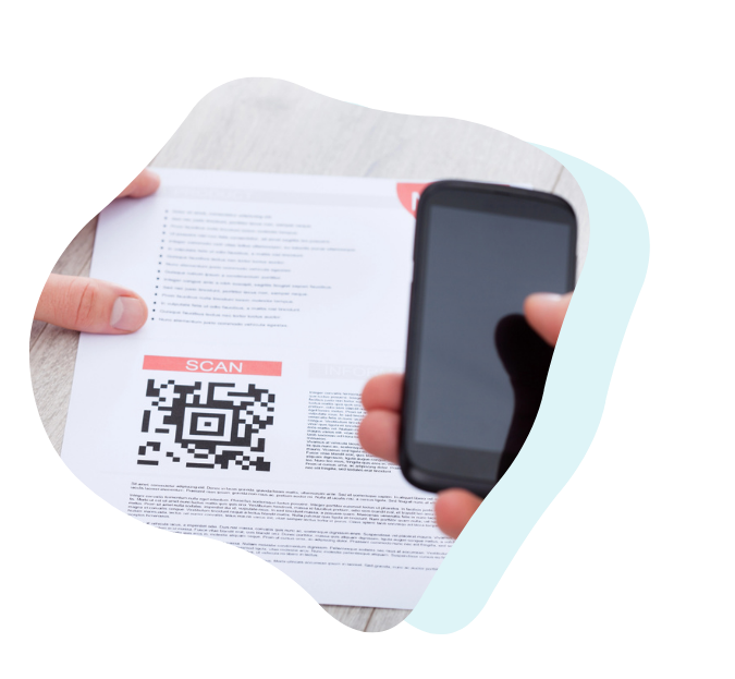Close-up of a person scanning a QR code on a printed medication instruction sheet using a smartphone providing quick access to helpful video guidance.